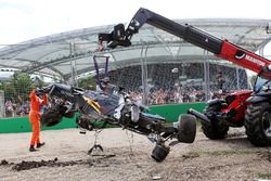 The McLaren MP4-31 of Fernando Alonso, McLaren is removed from the gravel trap after his race stopping crash