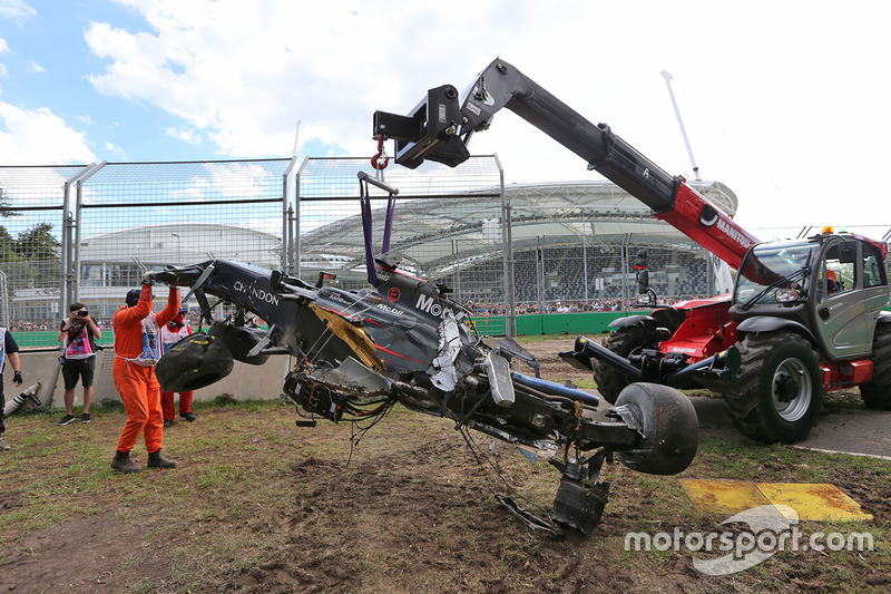 The McLaren MP4-31 of Fernando Alonso, McLaren is removed from the gravel trap after his race stoppi