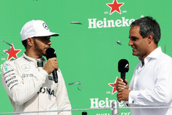 (L to R): Lewis Hamilton, Mercedes AMG F1 on the podium with Juan Pablo Montoya