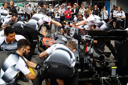 The McLaren team conduct a practice pit stop