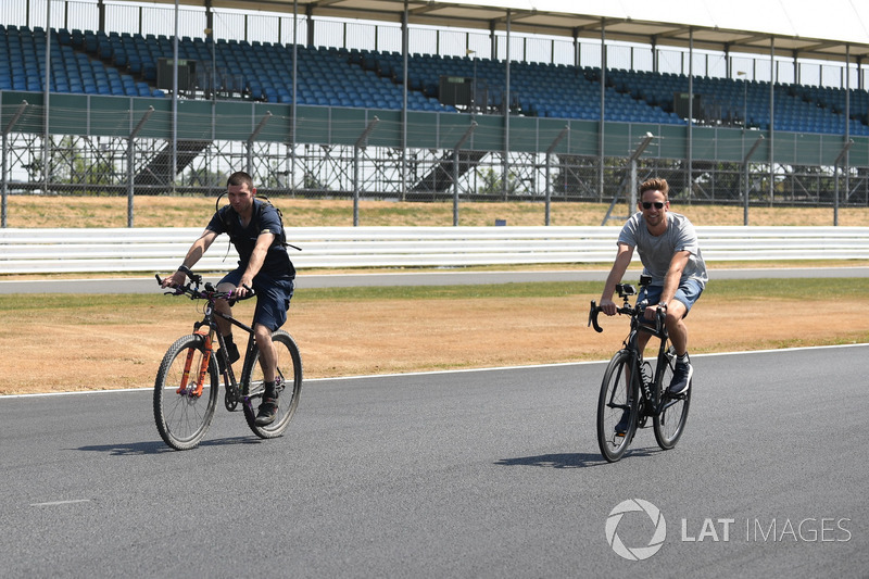 Guy Martin and Jenson Button, McLaren cycle on the track