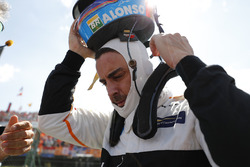 Fernando Alonso, McLaren, takes his helmet off on the grid