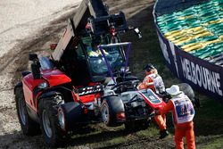 Marshals remove the car of Romain Grosjean, Haas F1 Team VF-18 Ferrari, from the circuit