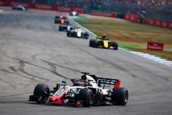 Romain Grosjean, Haas F1 Team VF-18, leads Carlos Sainz Jr., Renault Sport F1 Team R.S. 18