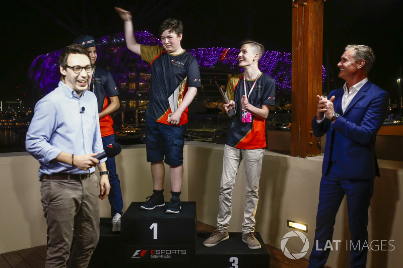 Brendon Leigh celebrates on the podium after winning the E-Sports event