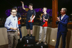 Brendon Leigh celebrates on the podium after winning the E-Sports event