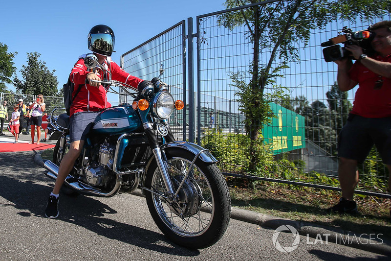 Sebastian Vettel, Ferrari arrives on his Suzuki 750 motorbike
