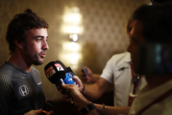 Fernando Alonso talks to the media after announcing his deal to race in the 2017 Indianapolis 500 in