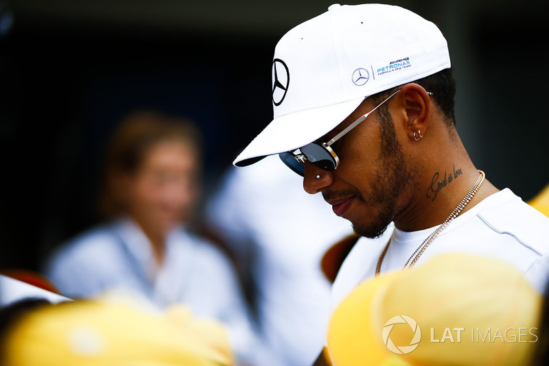 Lewis Hamilton, Mercedes AMG F1, signs autographs for fans