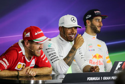 Sebastian Vettel, Ferrari, Lewis Hamilton, Mercedes AMG F1 and Daniel Ricciardo, Red Bull Racing in
