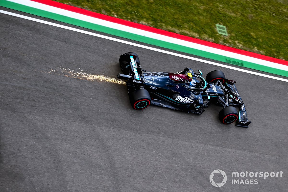 Sparks trail behind Valtteri Bottas, Mercedes W12