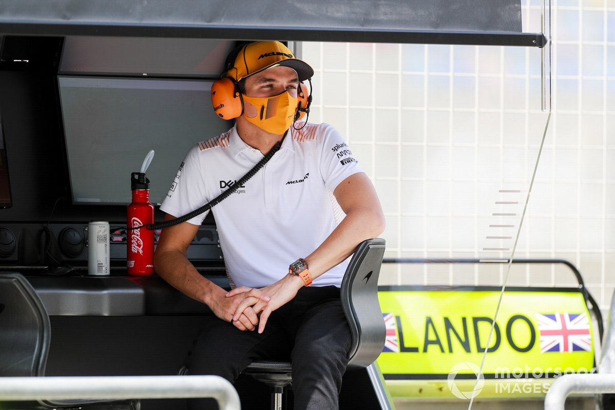 Lando Norris, McLaren on the pit wall
