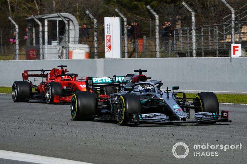 Valtteri Bottas, Mercedes F1 W11, leads Charles Leclerc, Ferrari SF1000