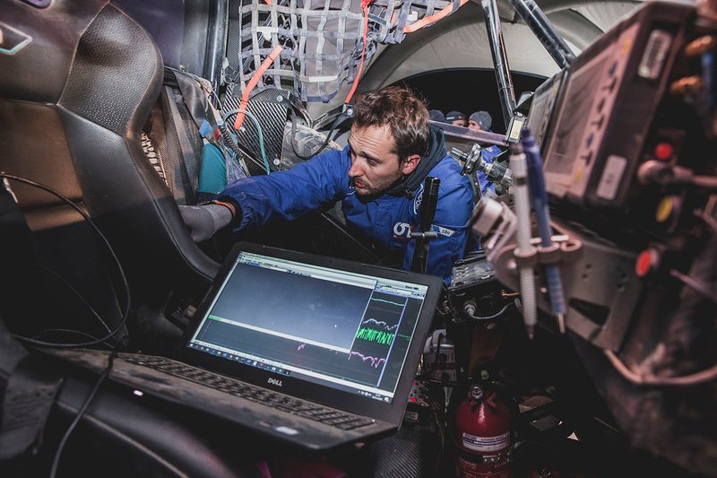 Mechanics at work on the Red Bull Off-Road Team USA OT3 