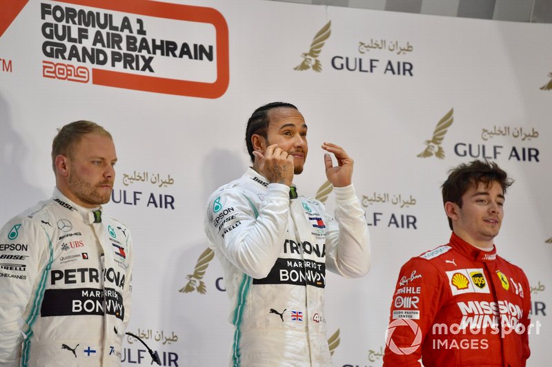 Valtteri Bottas, Mercedes AMG F1, 2nd position, Lewis Hamilton, Mercedes AMG F1, 1st position, and Charles Leclerc, Ferrari, 3rd position, on the podium