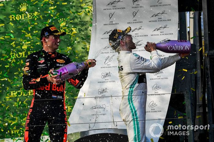 Max Verstappen, Red Bull Racing, 3rd position, sprays Valtteri Bottas, Mercedes AMG F1, 1st position, with Champagne