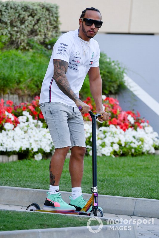 Lewis Hamilton, Mercedes AMG F1 on a scooter in the paddock