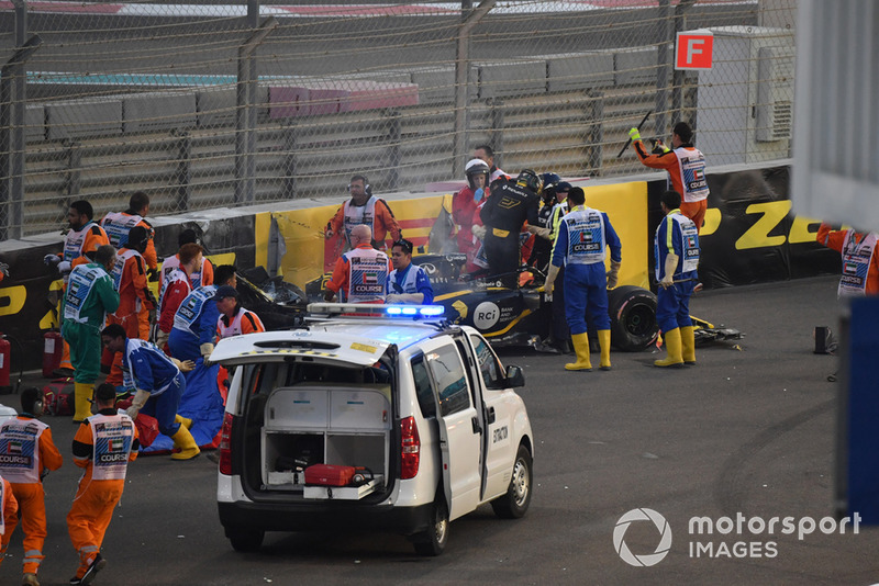 Medical team assist Nico Hulkenberg, Renault Sport F1 Team R.S. 18 after crashing and roling on lap one