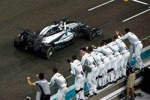 Lewis Hamilton, Mercedes F1 W05, celebrates as he crosses the line