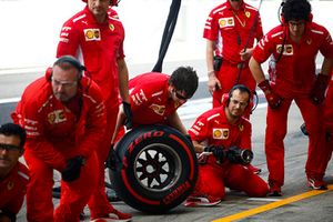 Ferrari pit crew at the ready during practice