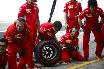 Ferrari pit crew at the ready during practice