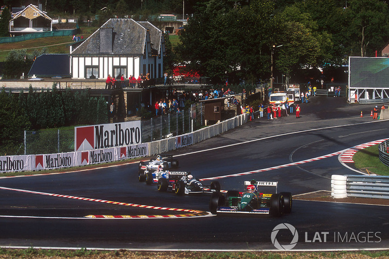 Erik Comas, Larrousse LH94 Ford, Andrea de Cesaris, Sauber C13 Mercedes, at the Eau Rouge chicane