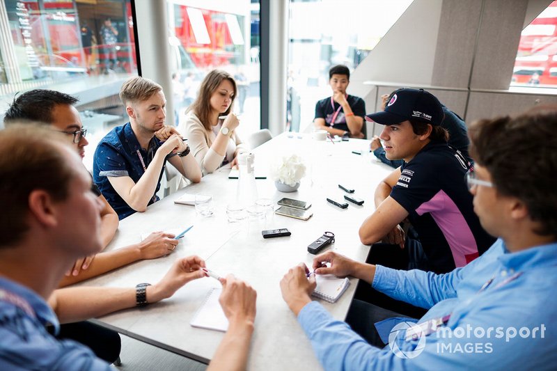 Lance Stroll, Racing Point, talks to the media