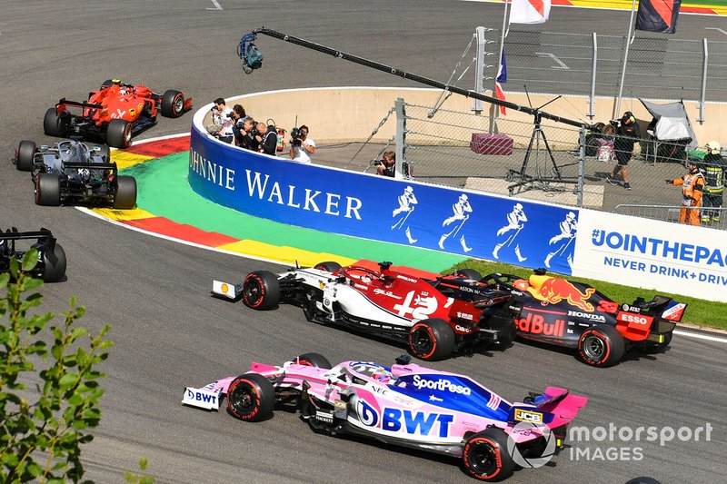 Charles Leclerc, Ferrari SF90, leads Sebastian Vettel, Ferrari SF90, Lewis Hamilton, Mercedes AMG F1 W10 and Valtteri Bottas, Mercedes AMG W10. Behind, Max Verstappen, Red Bull Racing RB15 makes contact with Kimi Raikkonen, Alfa Romeo Racing C38 