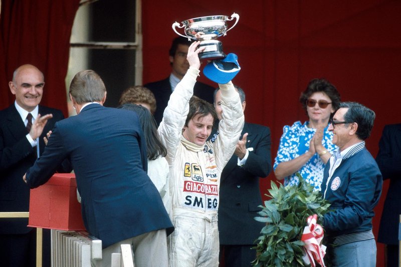 Gilles Villeneuve, Ferrari raises his trophy on the podium