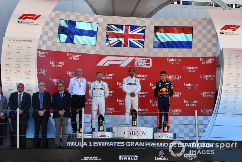 Dr Dieter Zetsche, CEO, Mercedes Benz Valtteri Bottas, Mercedes AMG F1, 2nd position, Lewis Hamilton, Mercedes AMG F1, 1st position, and Max Verstappen, Red Bull Racing, 3rd position, on the podium