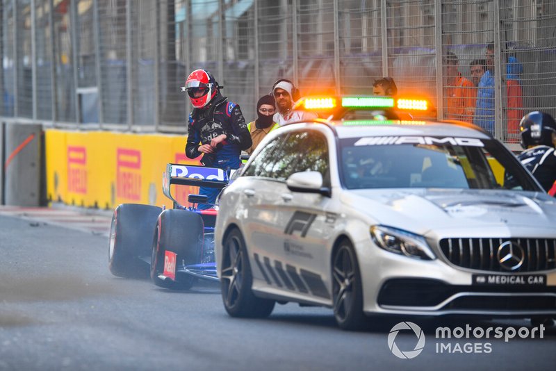 Daniil Kvyat, Toro Rosso STR14, climbs out of his car after a crash during FP2