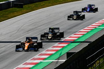 Carlos Sainz Jr., McLaren MCL34, leads Kevin Magnussen, Haas F1 Team VF-19, Romain Grosjean, Haas F1 Team VF-19, and Alexander Albon, Toro Rosso STR14