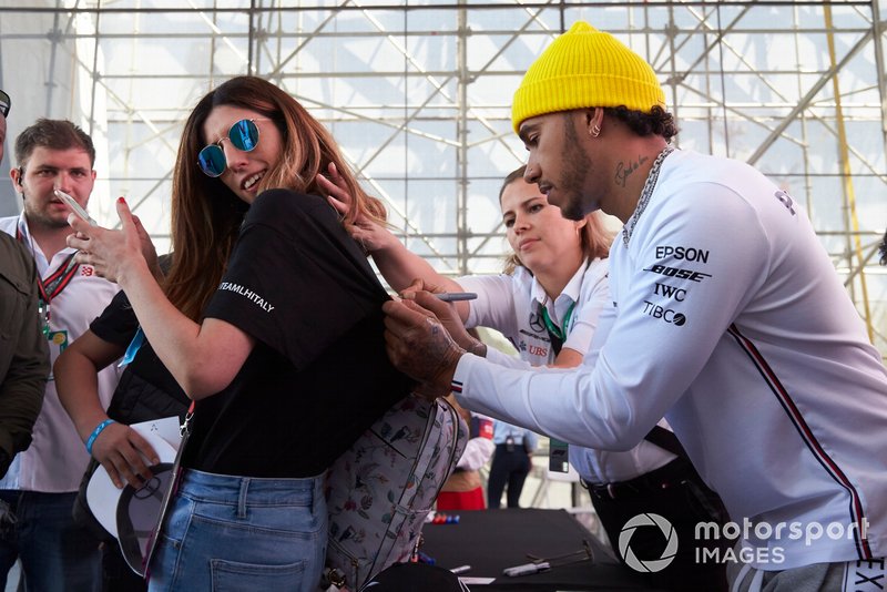 Lewis Hamilton, Mercedes AMG F1, signs autographs for fans