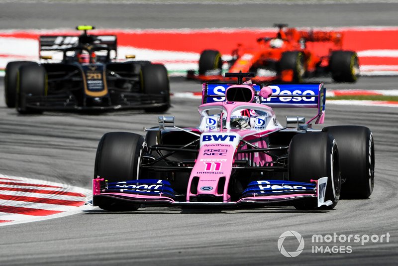 Sergio Perez, Racing Point RP19, leads Kevin Magnussen, Haas F1 Team VF-19, and Sebastian Vettel, Ferrari SF90
