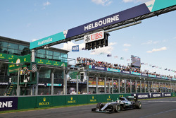 Race winner Nico Rosberg, Mercedes AMG F1 W07 takes the chequered flag at the end of the race