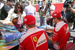 Kimi Raikkonen, Ferrari and Sebastian Vettel, Ferrari sign autographs for the fans