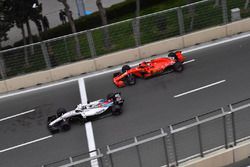 Lance Stroll, Williams FW41 and Kimi Raikkonen, Ferrari SF71H