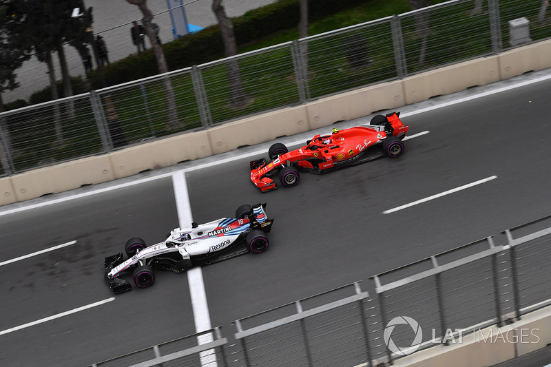 Lance Stroll, Williams FW41 et Kimi Raikkonen, Ferrari SF71H