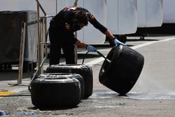 Red Bull Racing mechanic washes Pirelli tyres