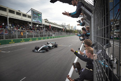 Lewis Hamilton, Mercedes AMG F1 W09, crosses the line for victory to the delight of his team