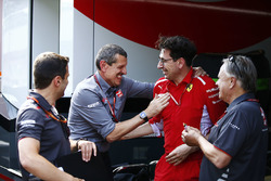 Guenther Steiner, Team Principal, Haas F1, is congratlated by a Gene Haas, Team Owner, Haas F1, and Mattia Binotto, Ferrari Chief Technical Officer