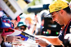 Daniel Ricciardo, Red Bull Racing, signs autographs for fans