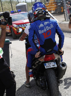 Race retiree Pierre Gasly, Scuderia Toro Rosso on a scooter