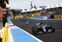 Lewis Hamilton, Mercedes AMG F1 W09, crosses the line to win the race