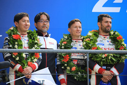 Overall podium: second place Mike Conway, Kamui Kobayashi, Jose Maria Lopez, Toyota Gazoo Racing