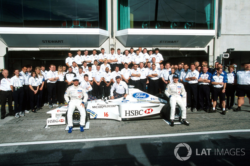 The Stewart team celebrate their first victory in F1
