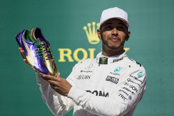 Usain Bolt presents Race winner Lewis Hamilton, Mercedes AMG F1, with a pair of his running shoes