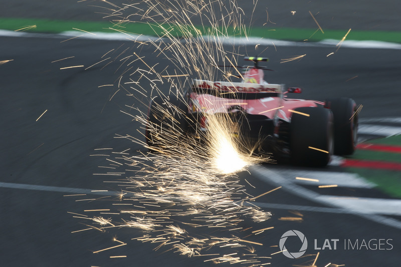 Sparks fly from the car of Kimi Raikkonen, Ferrari SF70H