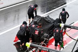 The car of Romain Grosjean, Haas F1 Team VF-17 is recovered after crashing