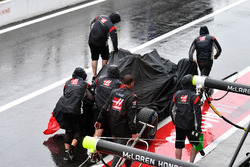 The car of Romain Grosjean, Haas F1 Team VF-17 is recovered after crashing